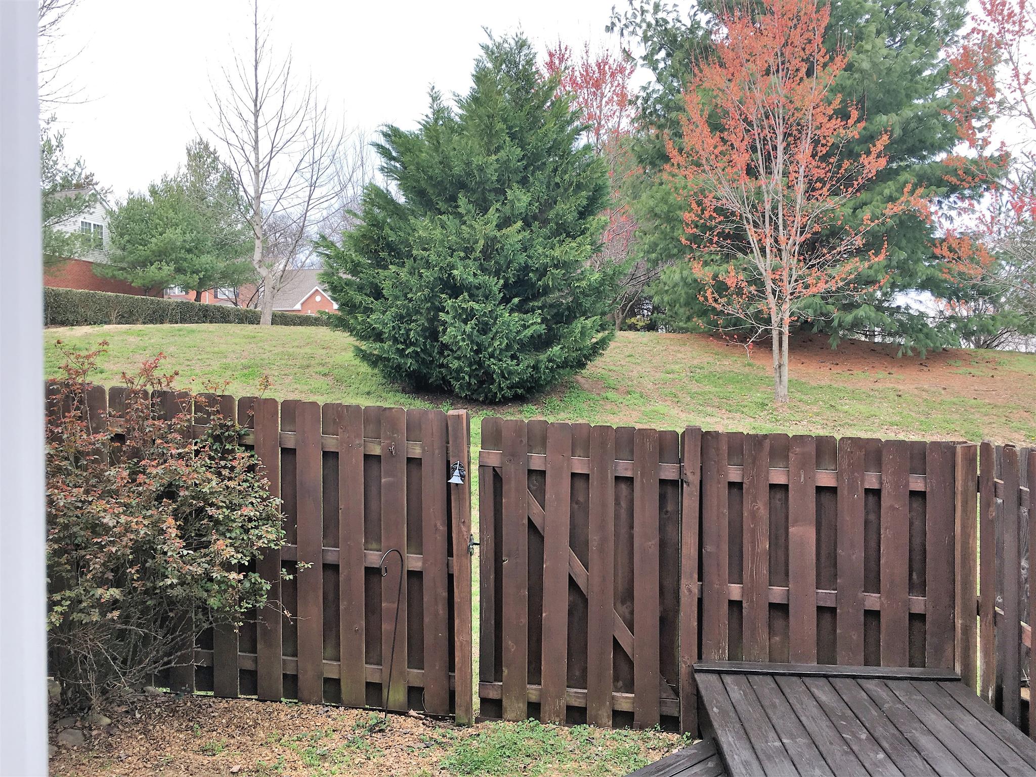 1101 Downs Boulevard, Unit A103 Franklin, TN 37064 - Photo 10 of 18 a view of a wooden fence