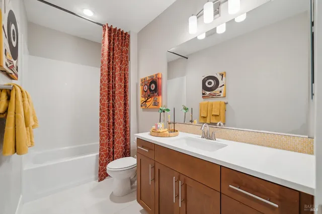 a bathroom with a sink a toilet and a bathtub