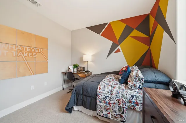 a bedroom with bed and a window