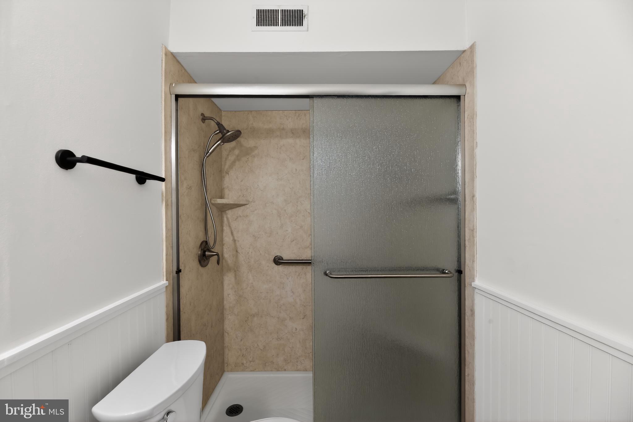 411 Stiles Avenue, Unit B11 Maple Shade, NJ 08052 - Photo 21 of 25 a bathroom with a shower and toilet