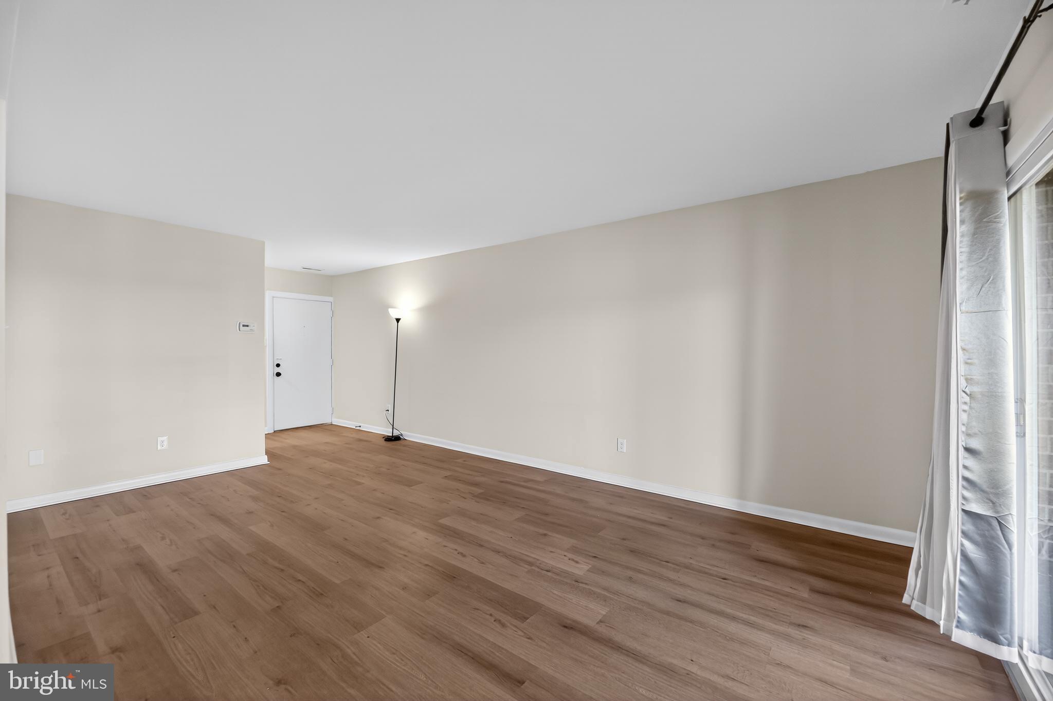 411 Stiles Avenue, Unit B11 Maple Shade, NJ 08052 - Photo 4 of 25 a view of empty room with wooden floor