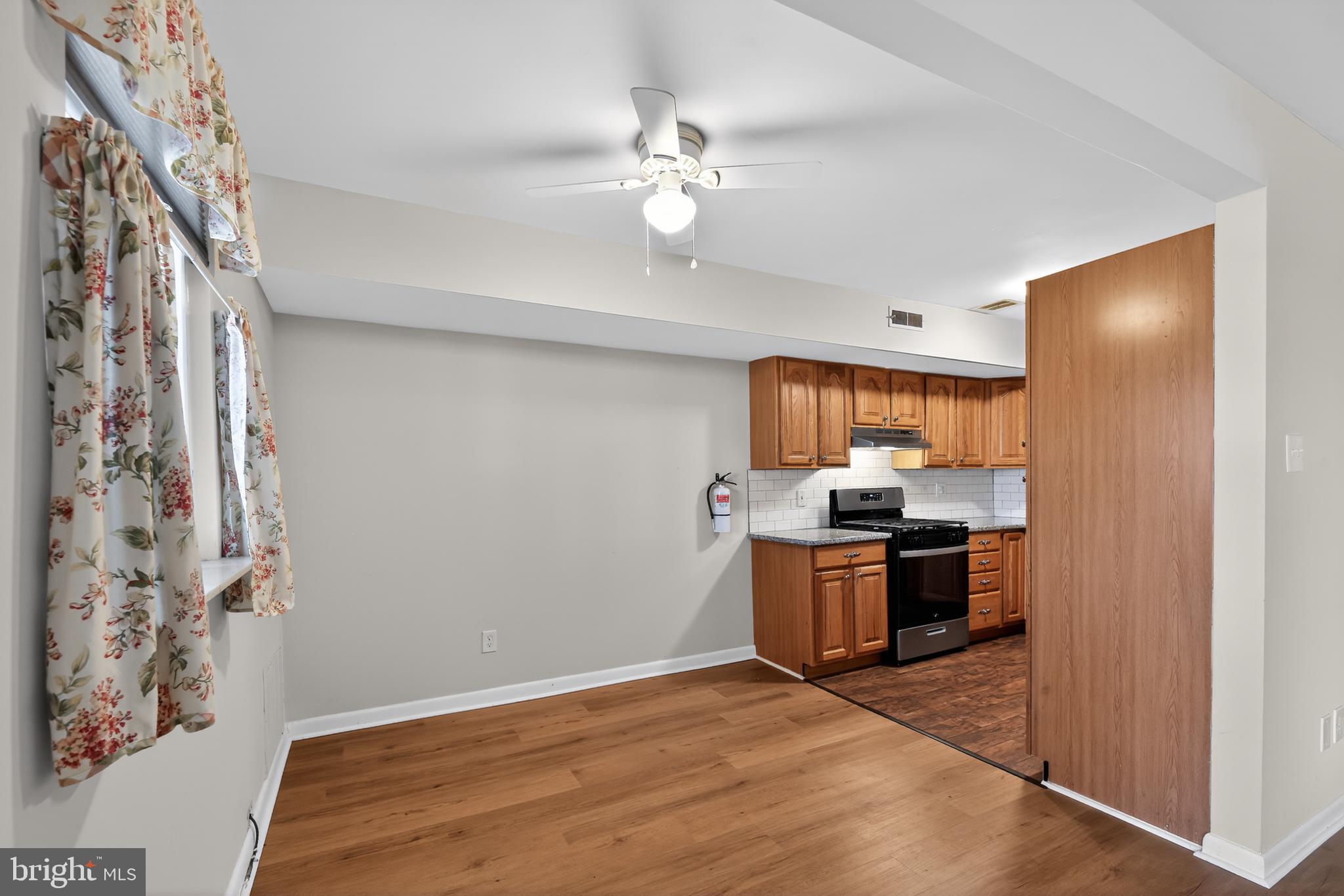 411 Stiles Avenue, Unit B11 Maple Shade, NJ 08052 - Photo 8 of 25 a kitchen with a stove a refrigerator and a sink