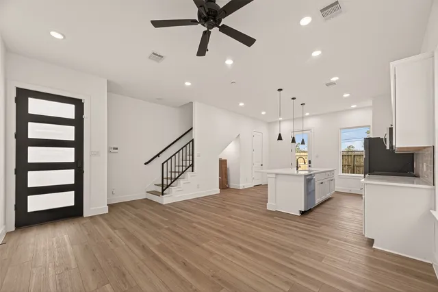 a view of kitchen with furniture and wooden floor