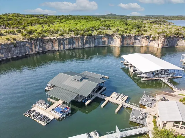 an aerial view of a house with a ocean view
