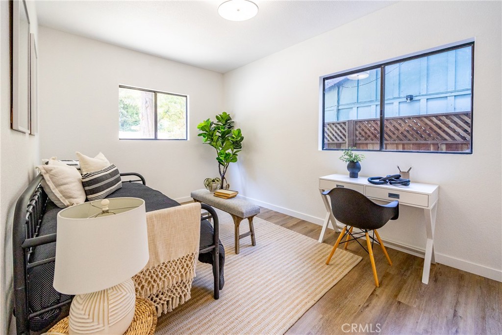 953 Sheffield Street Cambria, CA 93428 - Photo 54 of 68 a view of a workspace with furniture and wooden floor