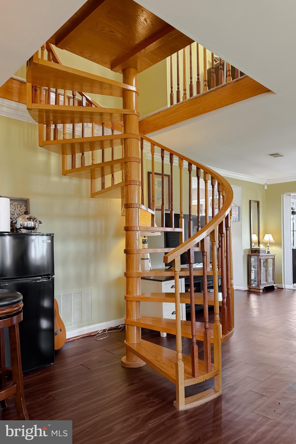 49716 Airedele Road Ridge, MD 20680 - Photo 26 of 101 spiral staircase leads to the upstairs common area