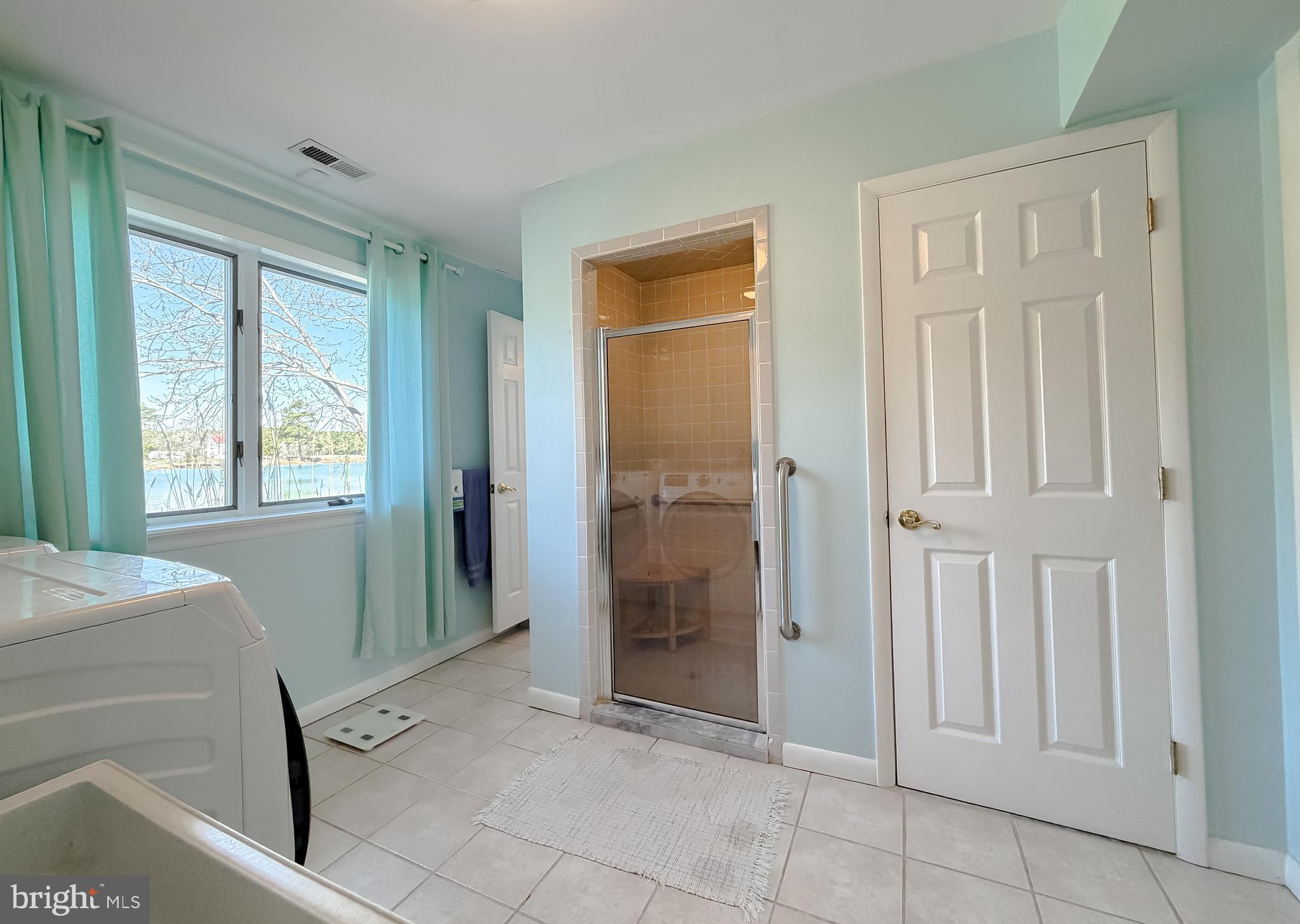 49716 Airedele Road Ridge, MD 20680 - Photo 44 of 101 Main level laundry includes shower