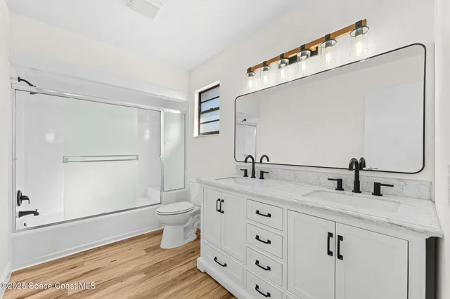 a bedroom with a bed and a table