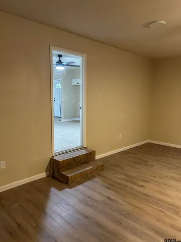 a view of wooden floor and a sink