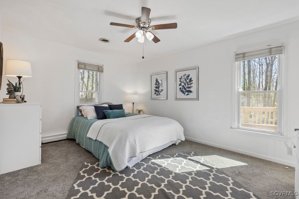 11041 Moravia Road Midlothian, VA 23112 - Photo 12 of 38 a bedroom with a large bed and a window