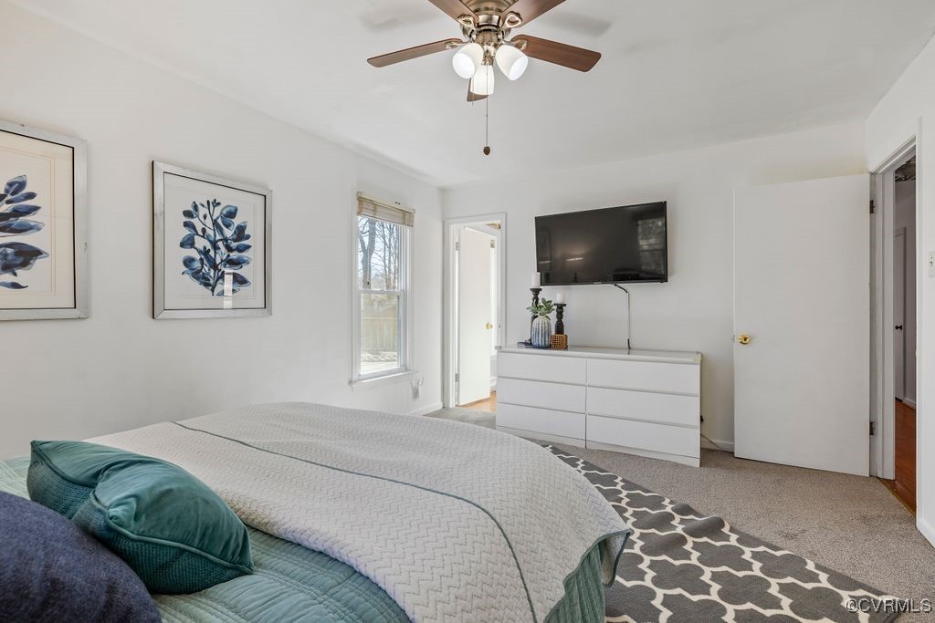 11041 Moravia Road Midlothian, VA 23112 - Photo 13 of 38 a bedroom with a bed and a flat screen tv