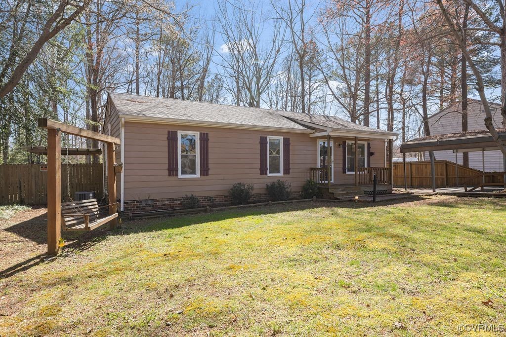 11041 Moravia Road Midlothian, VA 23112 - Photo 18 of 38 a swimming pool with outdoor seating and yard
