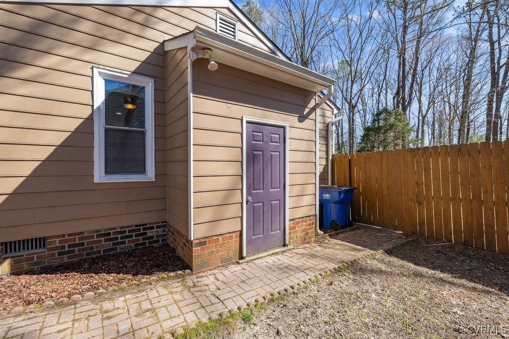 11041 Moravia Road Midlothian, VA 23112 - Photo 19 of 38 a view of a house with a door and wooden wall