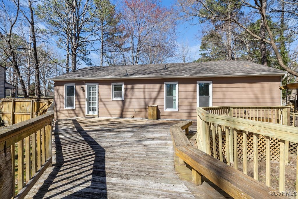 11041 Moravia Road Midlothian, VA 23112 - Photo 21 of 38 a view of a house with wooden deck and a large window