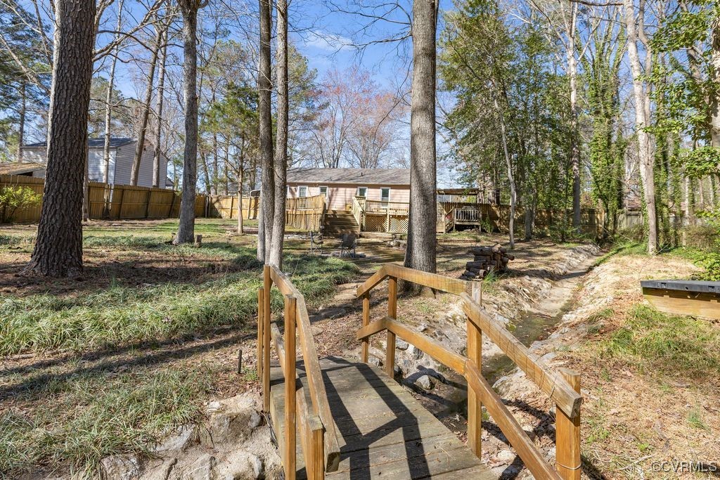 11041 Moravia Road Midlothian, VA 23112 - Photo 23 of 38 a view of a yard with a tree