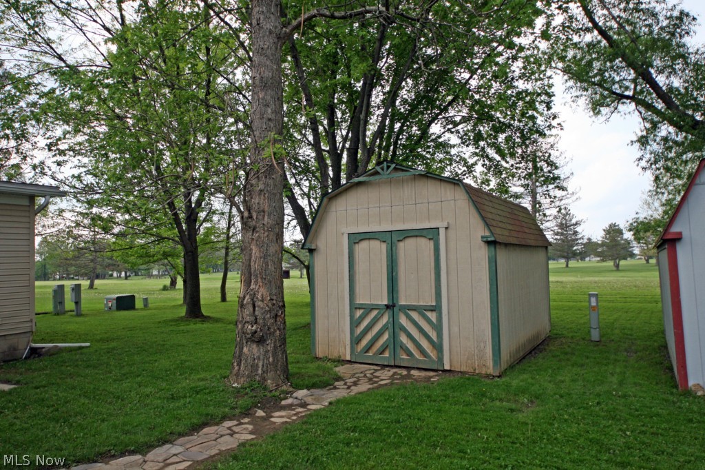 385 Stable Road Lagrange, OH 44050 - Photo 2 of 8 Large shed for storage. Lot backs to the Golf course!
