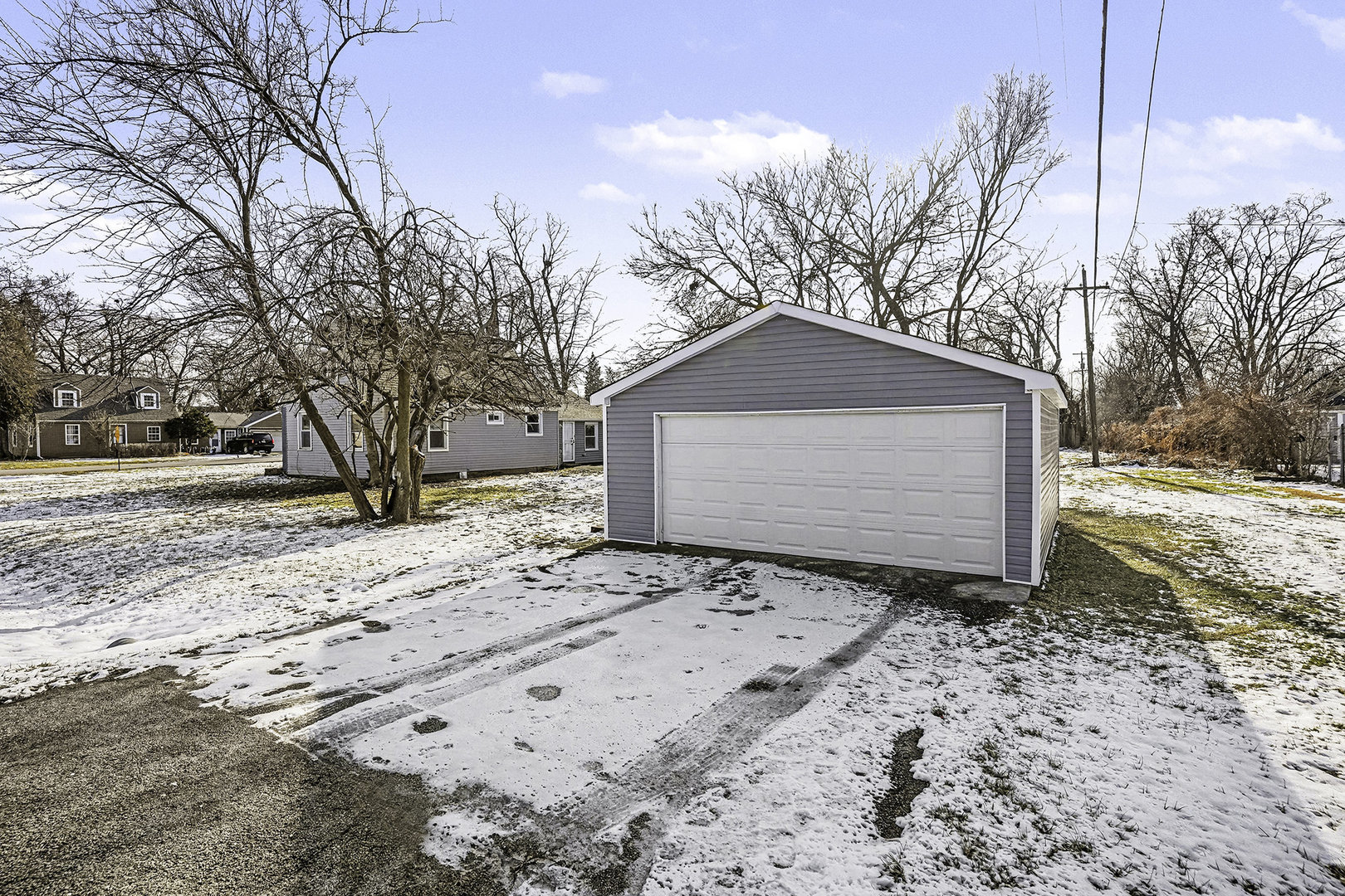 15700 Turner Avenue Markham, IL 60428 - Photo 14 of 15 a front view of a house with a yard covered in snow