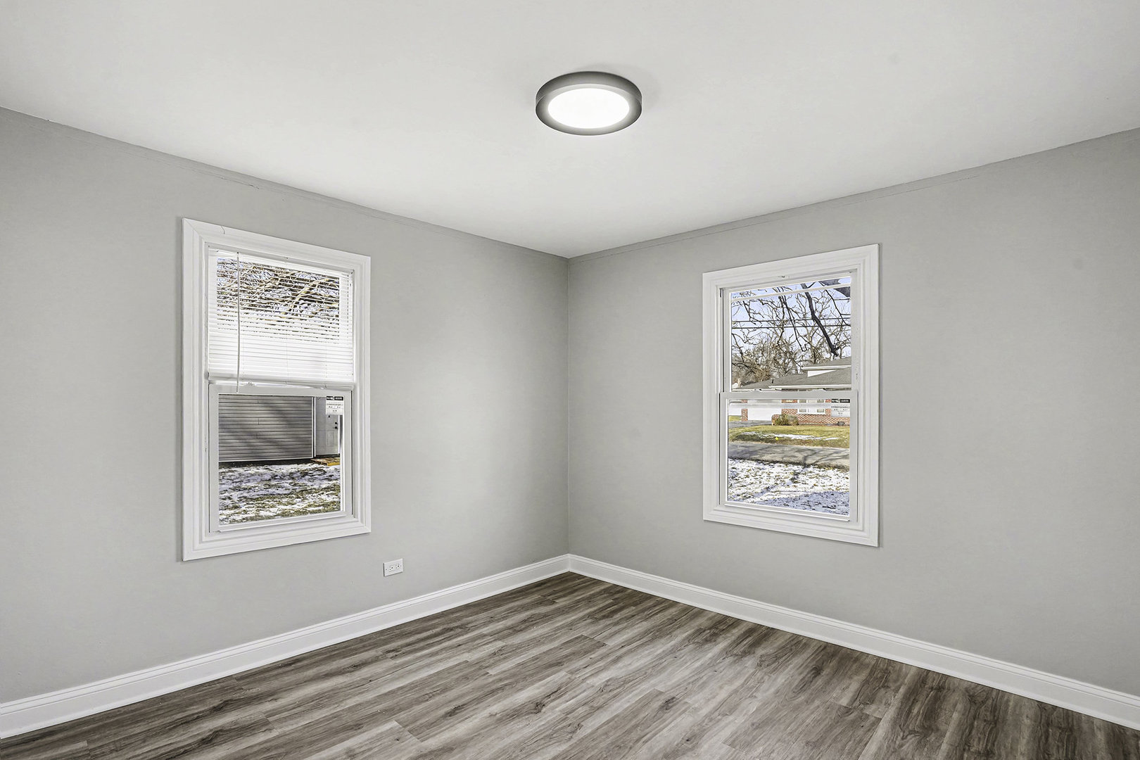 15700 Turner Avenue Markham, IL 60428 - Photo 3 of 15 an empty room with windows and wall paintings