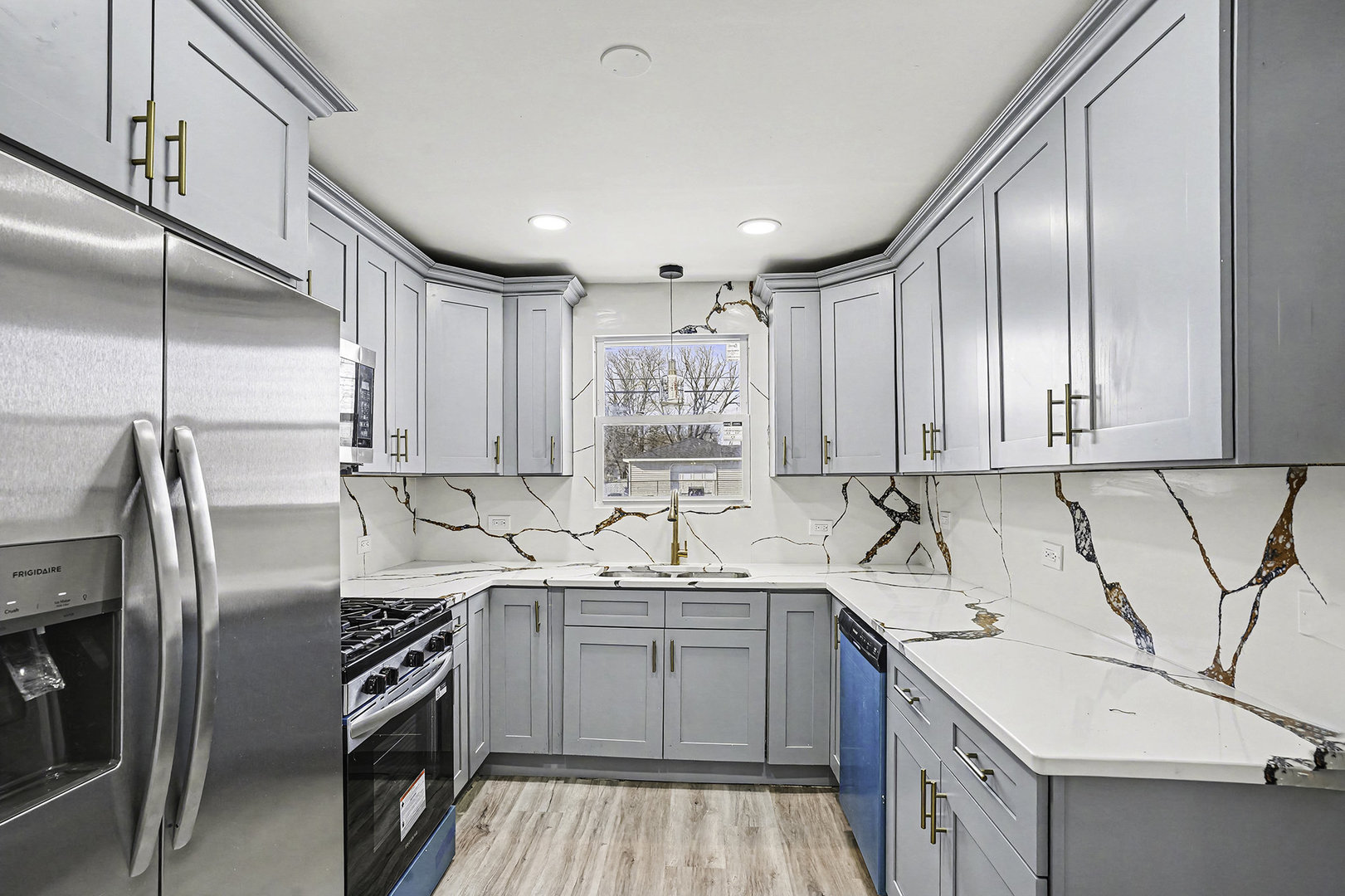 15700 Turner Avenue Markham, IL 60428 - Photo 7 of 15 a kitchen with a sink cabinets stainless steel appliances and a counter top space