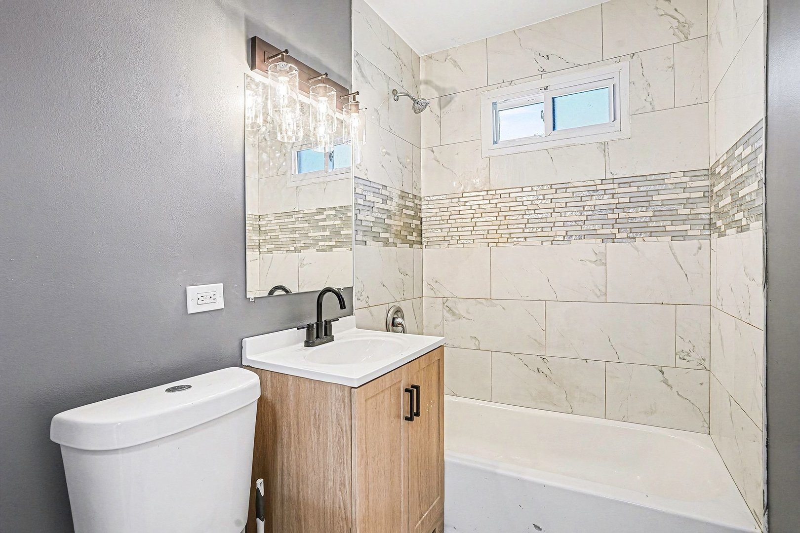 15700 Turner Avenue Markham, IL 60428 - Photo 8 of 15 a bathroom with a sink a toilet and shower