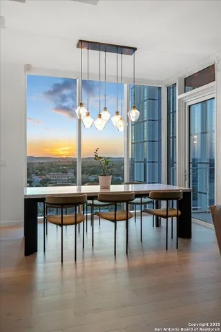 a view of a dining room with furniture window and wooden floor