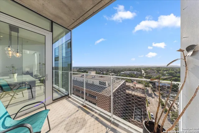 a view of a balcony with chairs