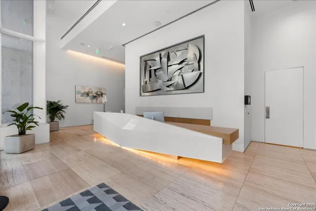 a living room with furniture and flowers