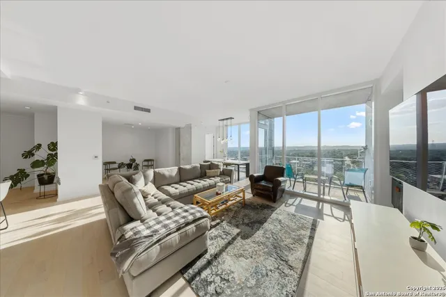 a living room with furniture and a table