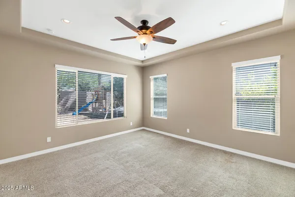 a bathroom with a bathtub sink vanity and mirror