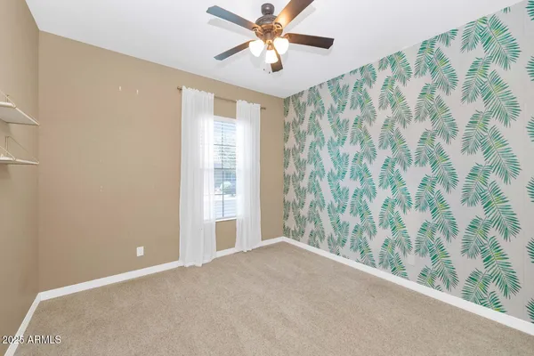 a bathroom with a sink toilet vanity and shower