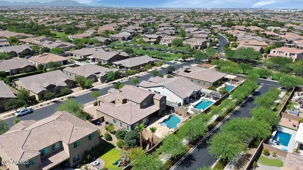 an aerial view of residential houses with outdoor space