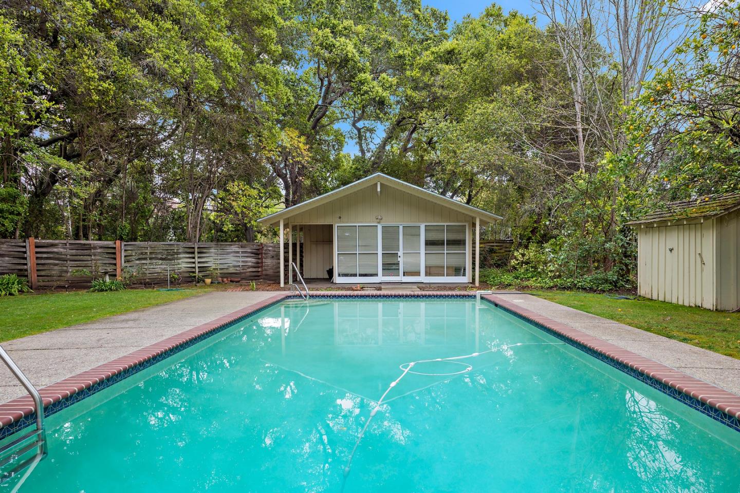 96 Edge Road Atherton, CA 94027 - Photo 27 of 28 a house with swimming pool in front of it