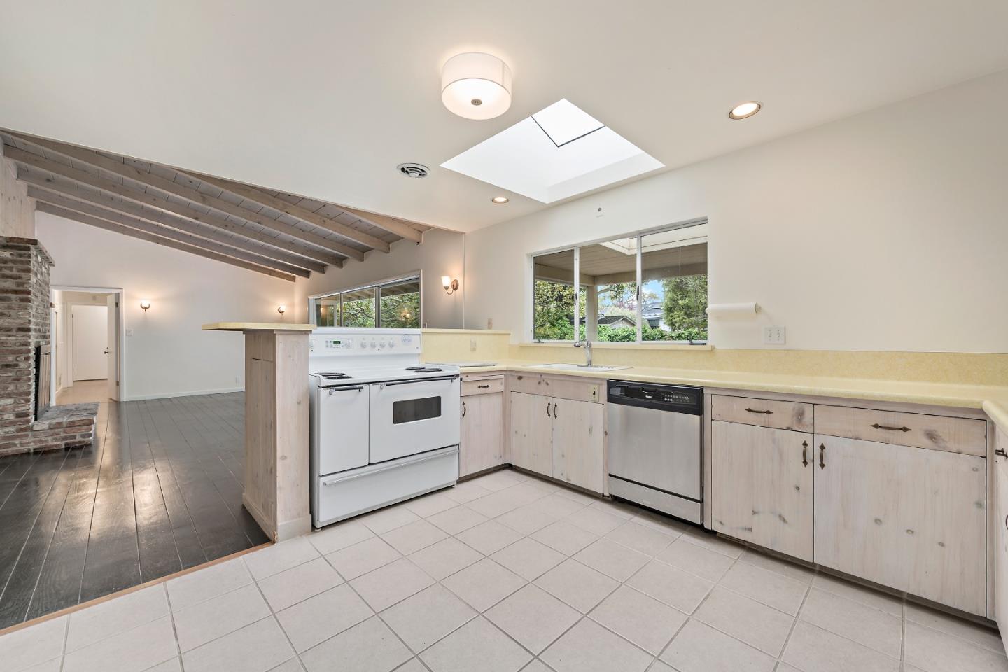 96 Edge Road Atherton, CA 94027 - Photo 8 of 28 a kitchen with granite countertop white cabinets and white stainless steel appliances
