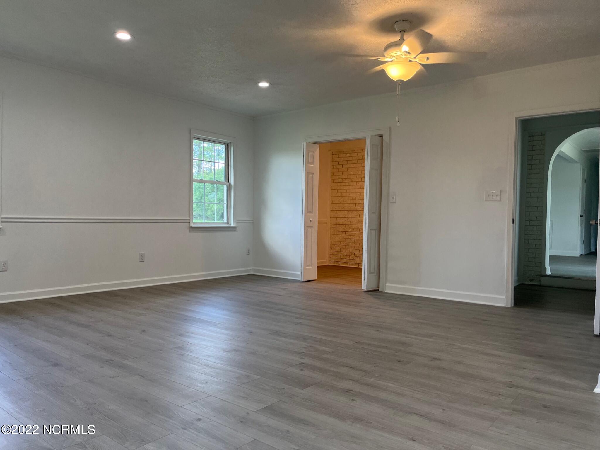 2240 Bird Cage Road Chadbourn, NC 28431 - Photo 14 of 16 master bedroom view looking toward closet and hallway to main living area