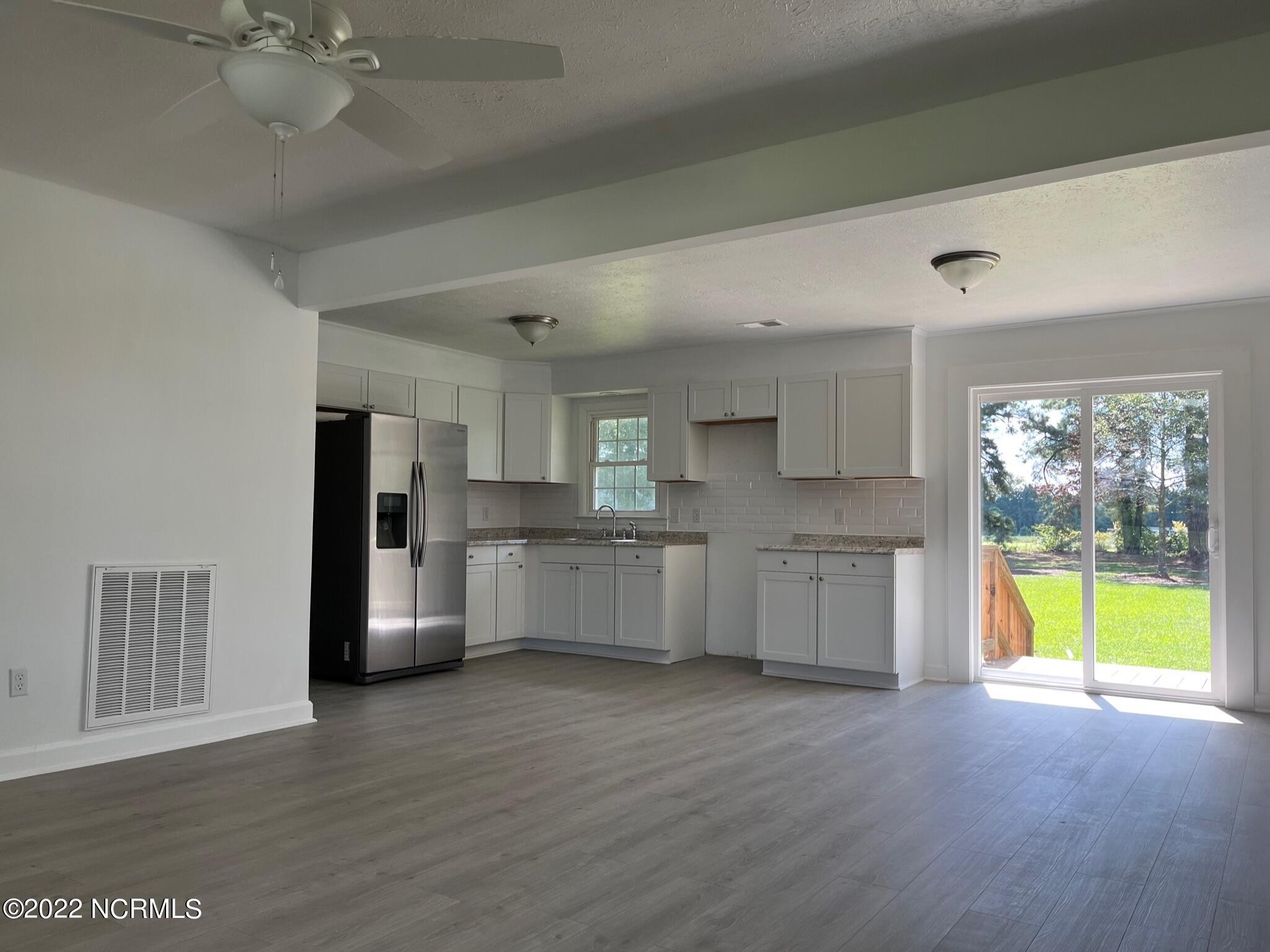 2240 Bird Cage Road Chadbourn, NC 28431 - Photo 16 of 16 Open floor plan view from living room into kitchen and dining area