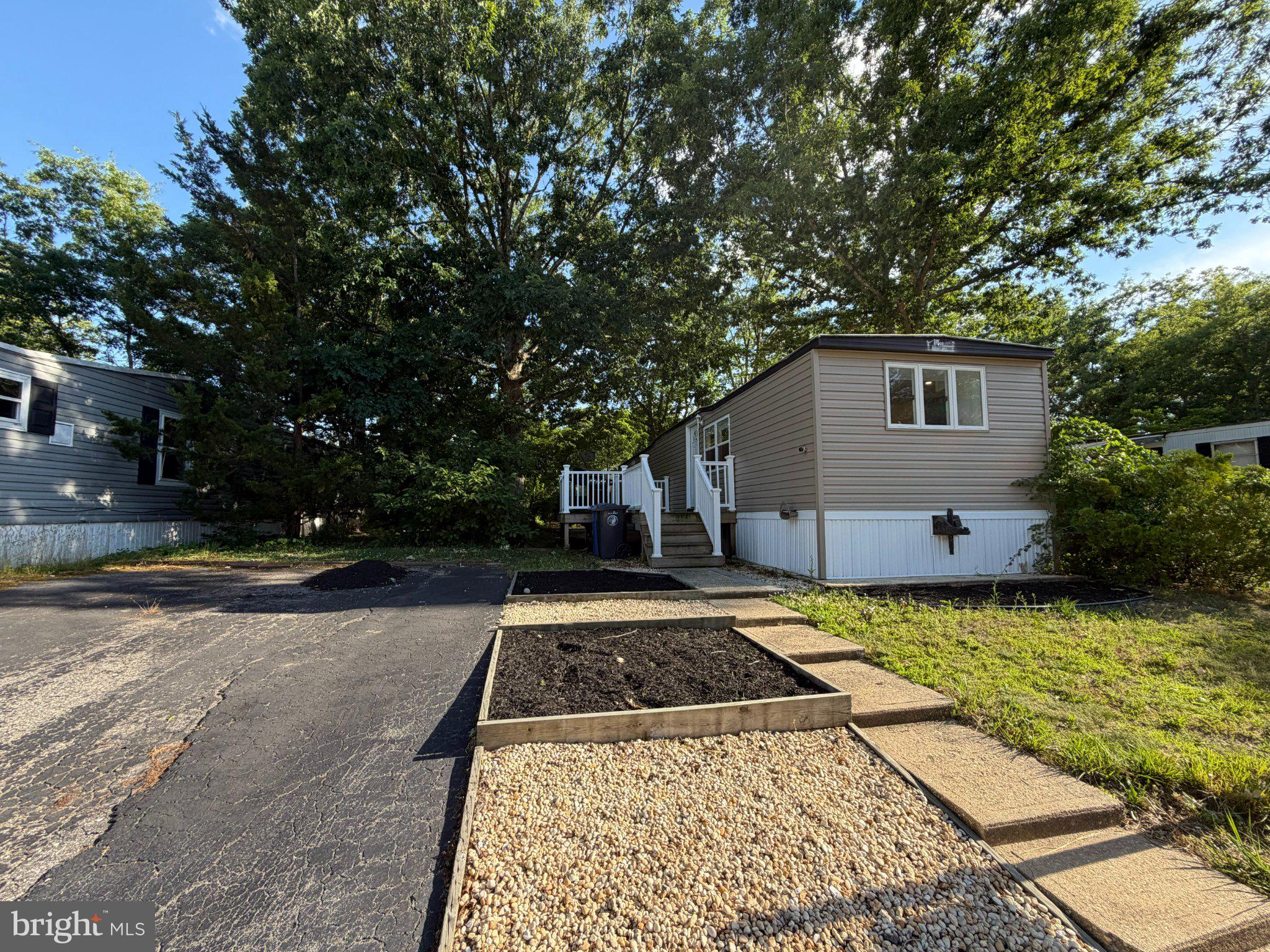 66 Roberts Road Toms River, NJ 08755 - Photo 1 of 13 Charming home with lush greenery.