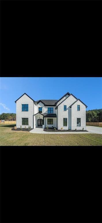 3285 Hall Road Dacula, GA 30019 - Photo 4 of 20 a view of a house with a yard