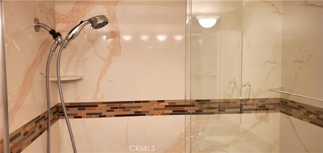 a bathroom with a tub and a shower