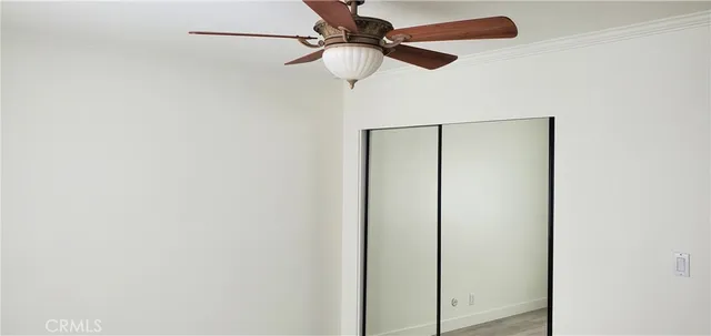 a view of a chandelier fan and a window