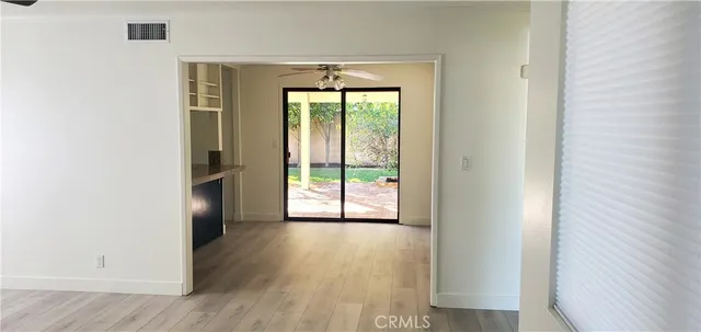 a view of a room that has a window in it