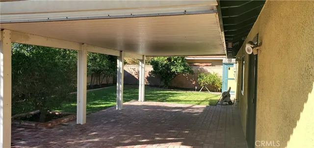 a view of a back yard from a room