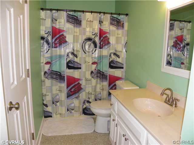 2511 Hicks Road North Chesterfield, VA 23235 - Photo 10 of 11 a bathroom with a sink mirror vanity and toilet