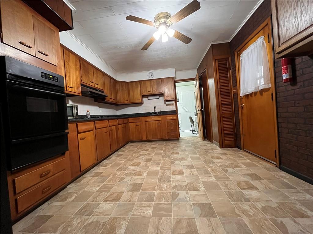 5124 Carnegie Street Pittsburgh, PA 15201 - Photo 11 of 44 a kitchen with stainless steel appliances granite countertop a refrigerator a stove and a sink with cabinets