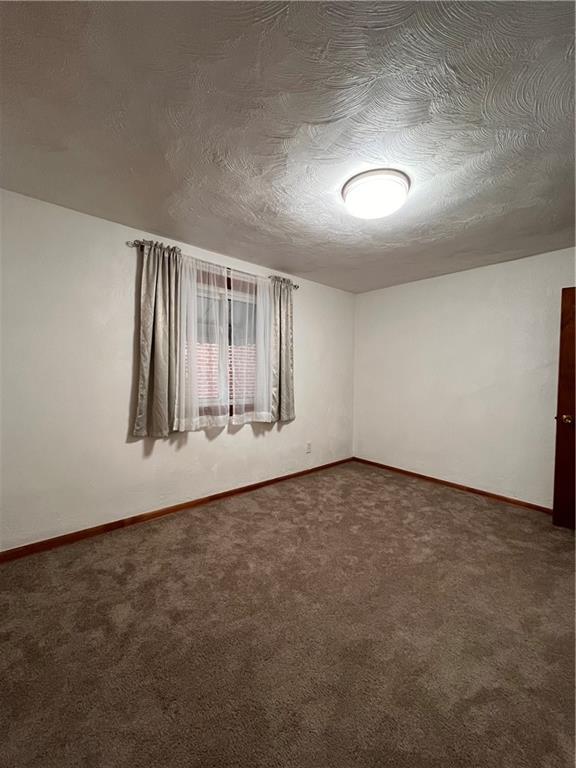 5124 Carnegie Street Pittsburgh, PA 15201 - Photo 17 of 44 an empty room with wooden floor and windows