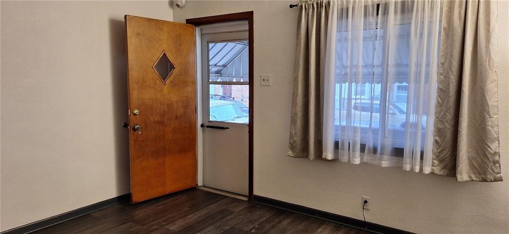 5124 Carnegie Street Pittsburgh, PA 15201 - Photo 5 of 44 an empty room with wooden floor and windows