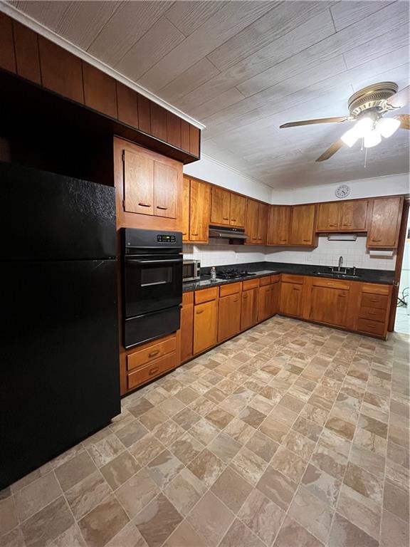 5124 Carnegie Street Pittsburgh, PA 15201 - Photo 10 of 44 a kitchen with stainless steel appliances granite countertop a refrigerator and a stove top oven