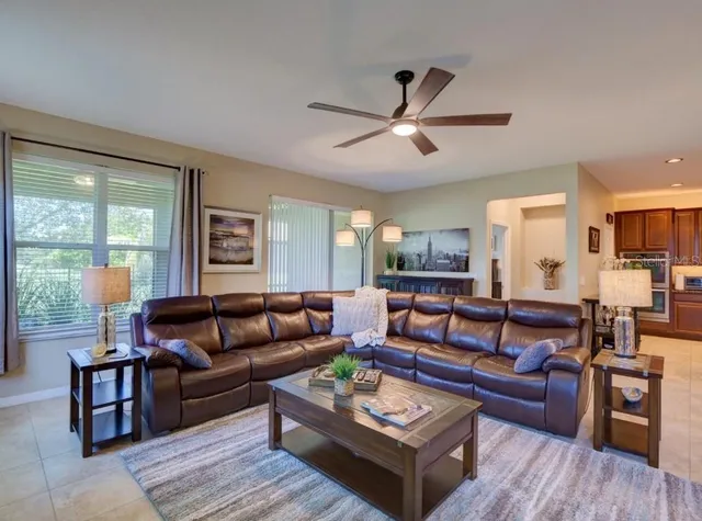 a living room with furniture and a large window