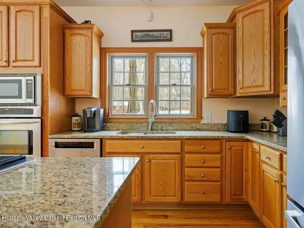 a bathroom with a sink mirror and toilet