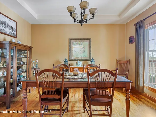 a living room with furniture or couch and a wooden floor