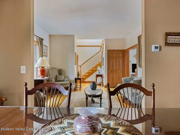 a living room with furniture a ceiling fan and a rug